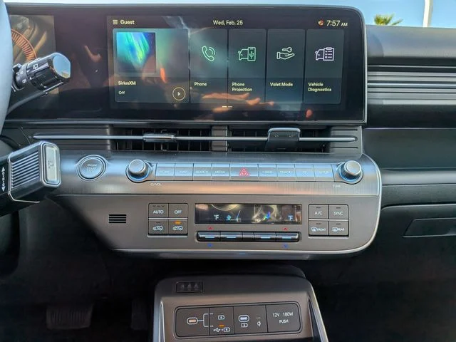 The Hyundai Kona center touchscreen with physical climate and audio controls below it